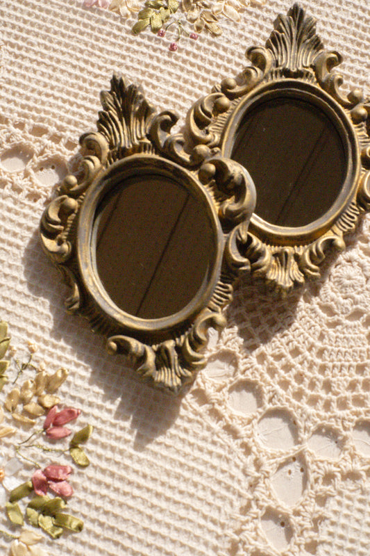 Pair of vintage ornate mirrors