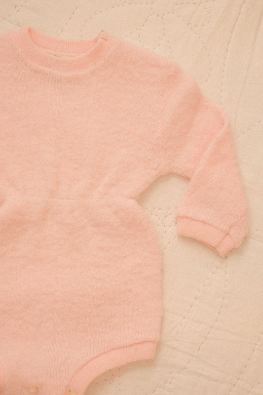 Vintage soft pink knit baby onesie