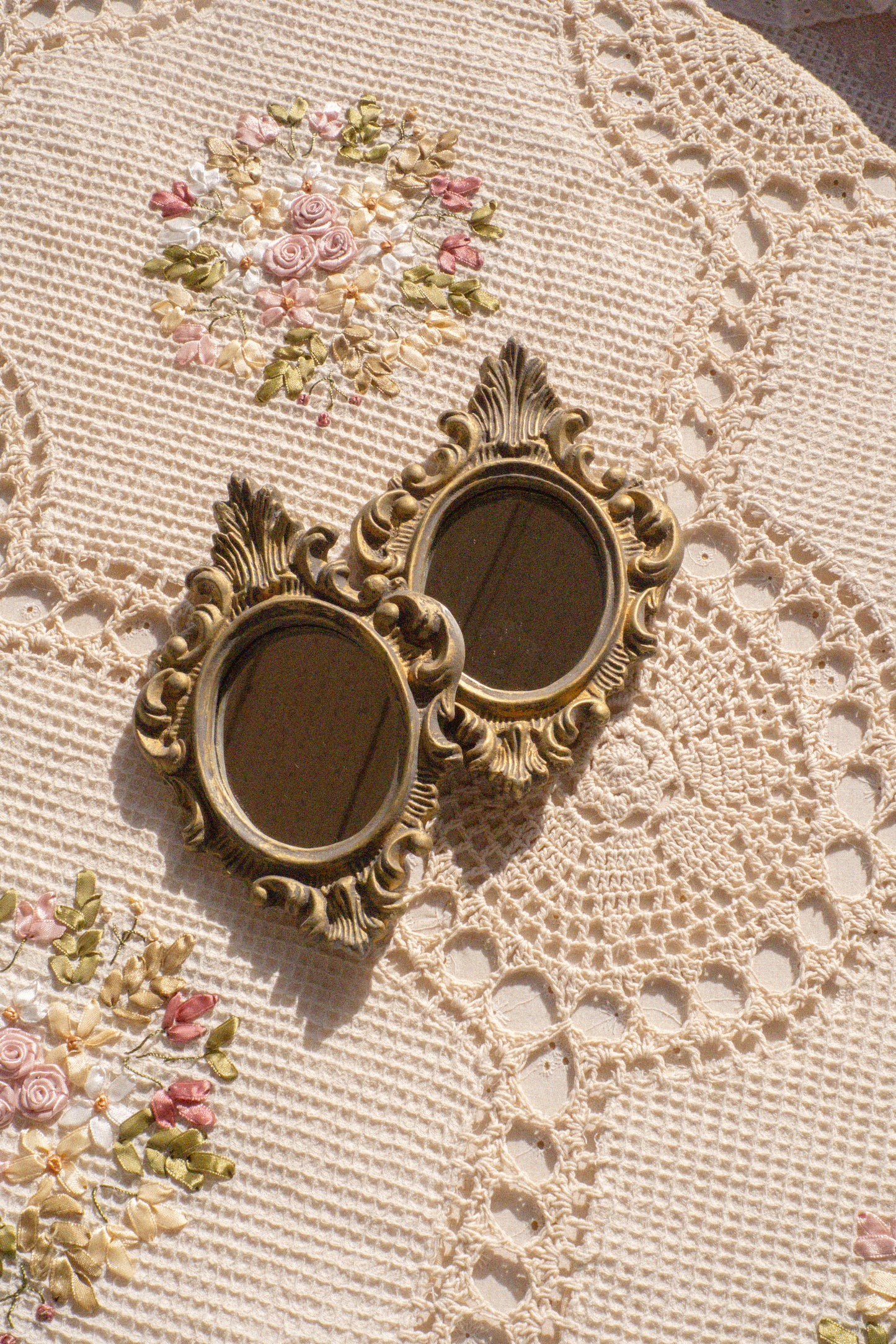 Pair of vintage ornate mirrors