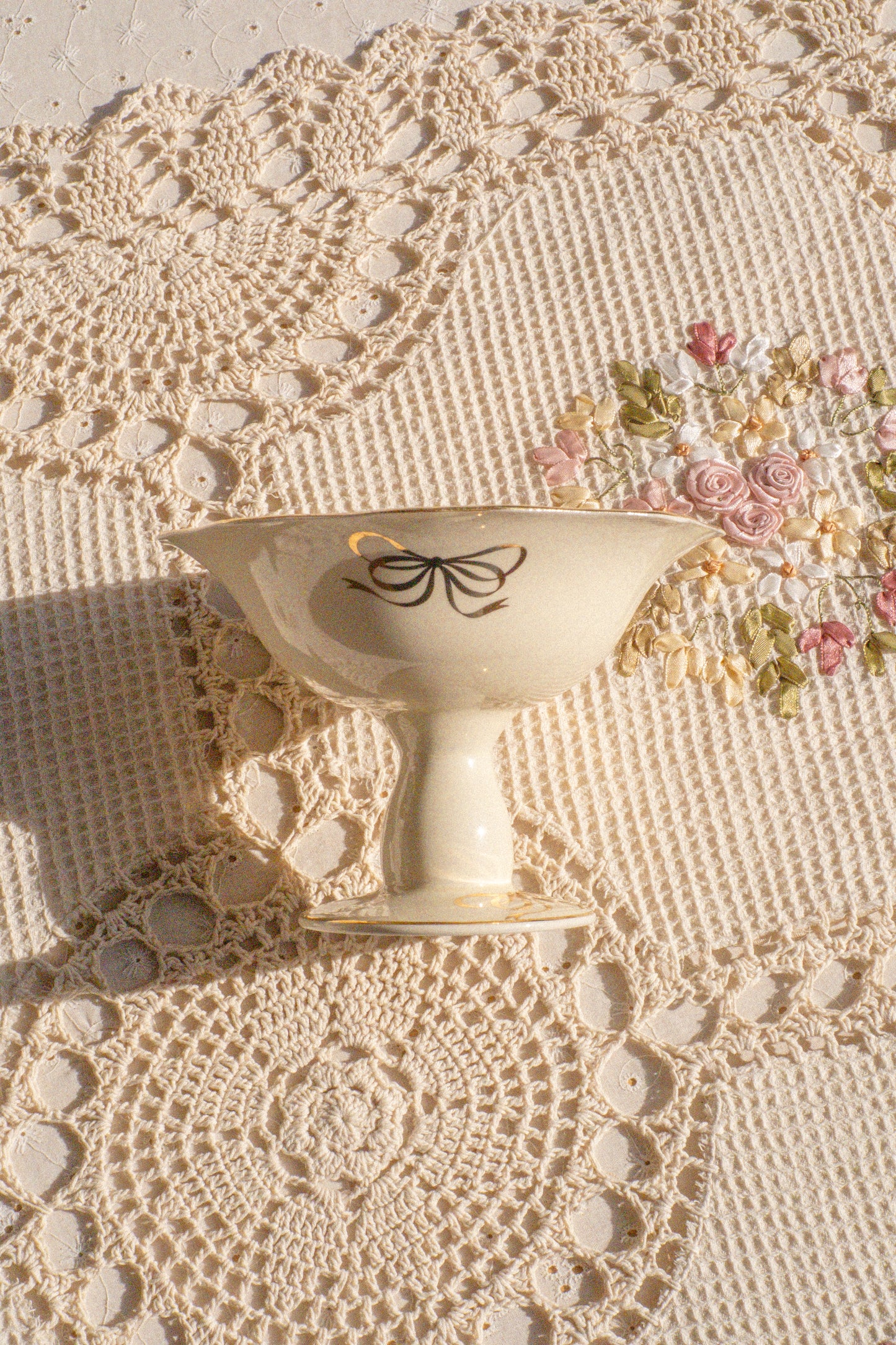 Vintage pedestal bow trinket dish